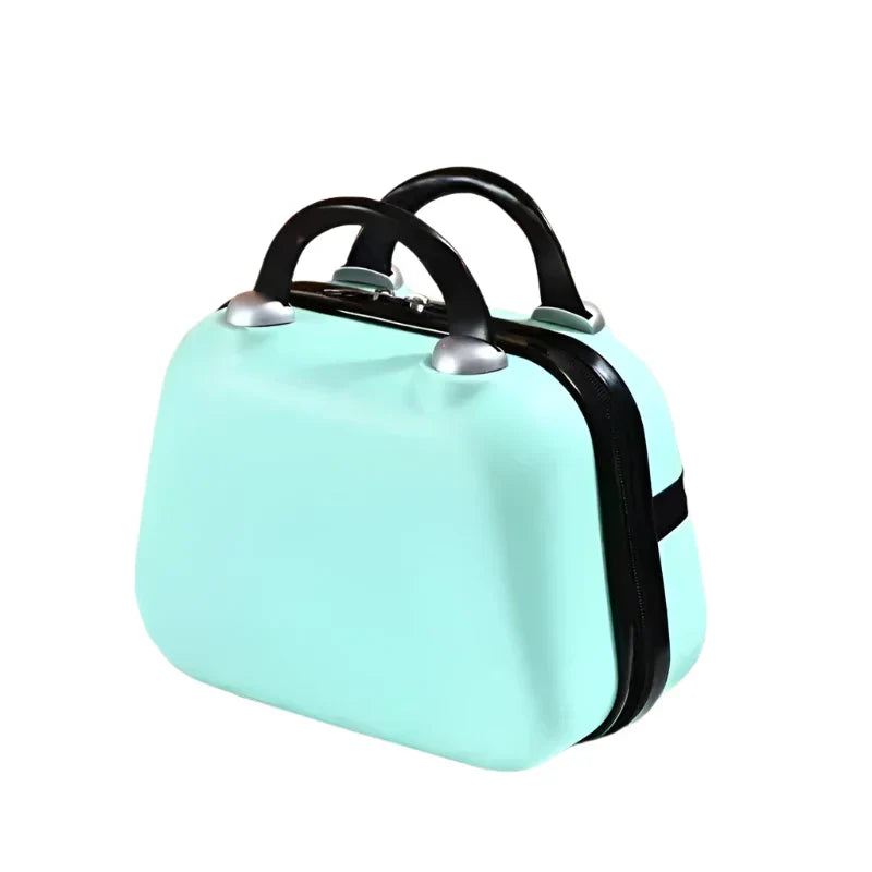 Valigia rigida verde menta con manici neri, design compatto e moderno, ideale per viaggi brevi. Accessorio da viaggio elegante e funzionale.