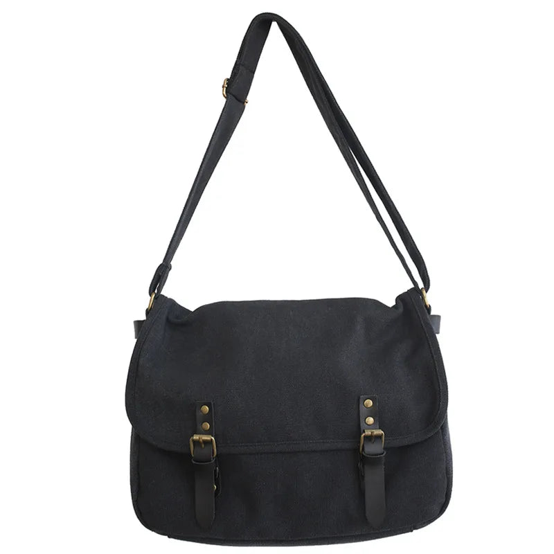 Borsa a tracolla nera in tela con fibbie decorative, design elegante e pratico, ideale per uso quotidiano e lavoro. Accessorio moda versatile.
