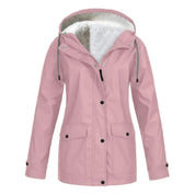 Giacca invernale rosa da donna con cappuccio, fodera in pelliccia sintetica, chiusura a bottoni, tasche frontali. Ideale per moda autunno-inverno.