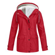 Giacca impermeabile rossa da donna con cappuccio, fodera in pelliccia sintetica, tasche frontali e chiusura a bottoni. Ideale per l'inverno.
