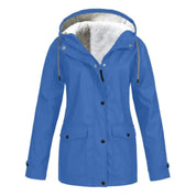Giacca impermeabile blu da donna con cappuccio foderato in pelliccia sintetica, chiusura a bottoni, tasche frontali. Ideale per l'inverno.