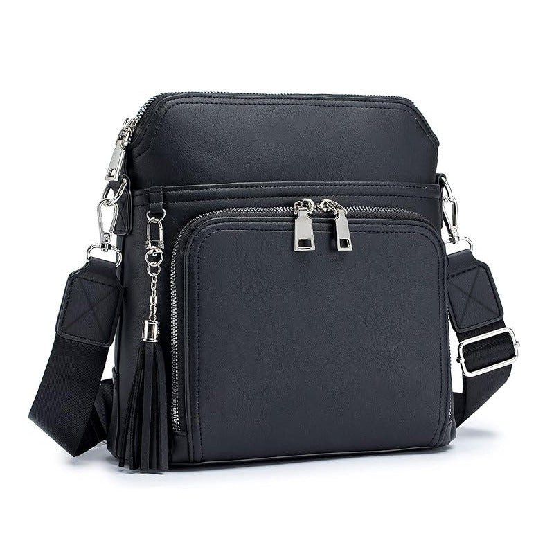 Enhance your style with the chic anti-theft shoulder bag Natalie with fashionable tassel accents