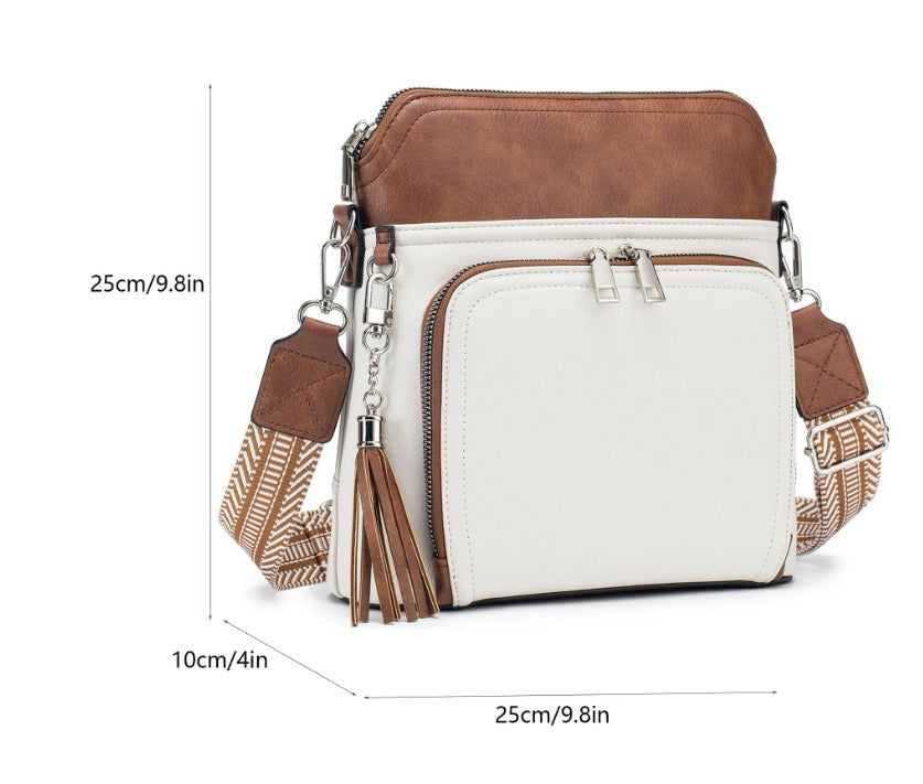 Enhance your style with the chic anti-theft shoulder bag Natalie with fashionable tassel accents