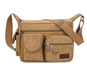 Borsa a tracolla in tela marrone chiaro con tasche multiple e cerniere, ideale per uomo e donna. Design casual e resistente, perfetta per viaggi.