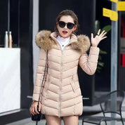 Maria | Chaqueta acolchada brillante para mujer con capucha de piel sintética