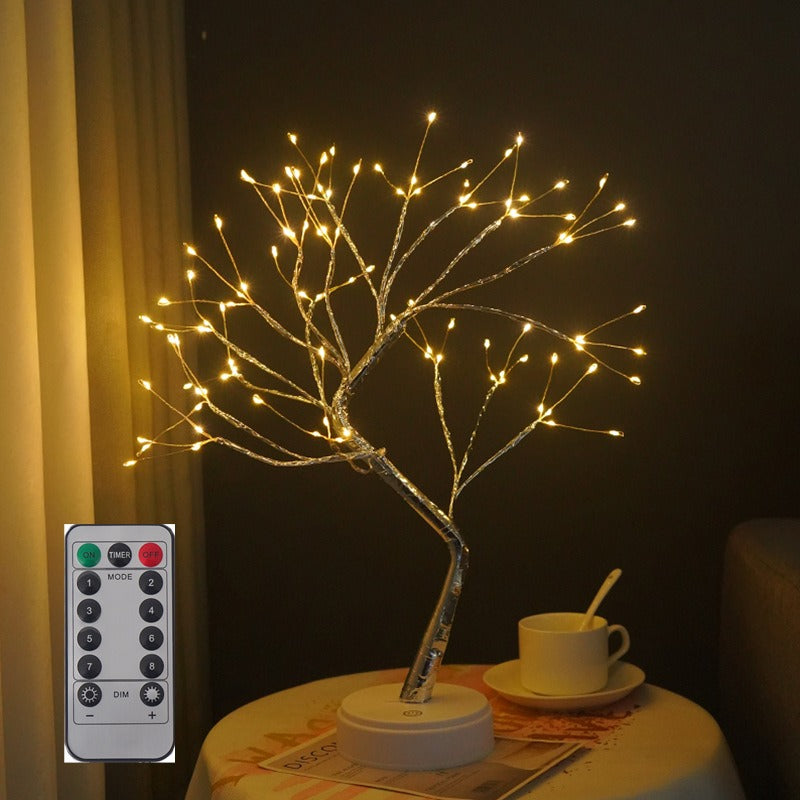Albero decorativo LED luminoso su tavolo, con telecomando. Design elegante per interni, perfetto per illuminazione ambientale e decorazione casa.
