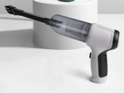 Aspirapolvere portatile senza fili su sfondo bianco, design ergonomico, ideale per pulizia auto e casa. Tecnologia avanzata, compatto ed efficiente.