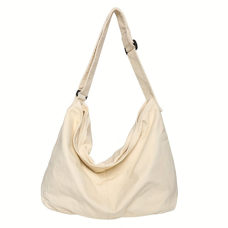 Borsa a tracolla beige in tessuto morbido, design casual e capiente, ideale per uso quotidiano. Accessorio moda donna versatile e trendy.