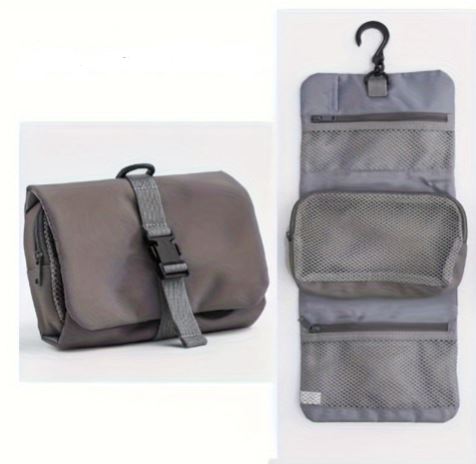 Gray travel toiletry bag with hanging hook, multiple mesh compartments, and secure buckle closure. Ideal for organizing toiletries on the go.