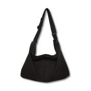 Borsa a tracolla nera in tessuto, design minimalista, ideale per uso quotidiano. Accessorio moda donna, capiente e versatile.
