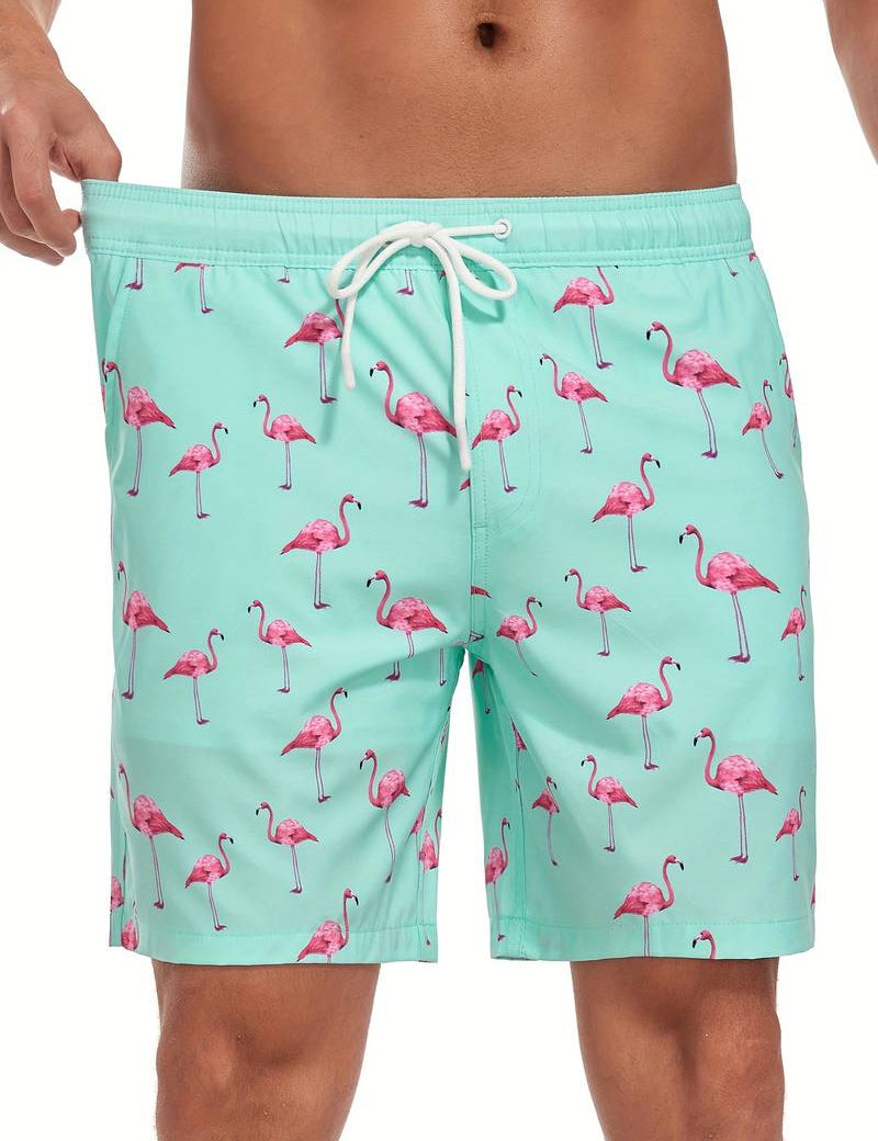 Costume da bagno uomo verde menta con stampa fenicotteri rosa, laccio in vita. Design estivo, moda mare, abbigliamento da spiaggia.