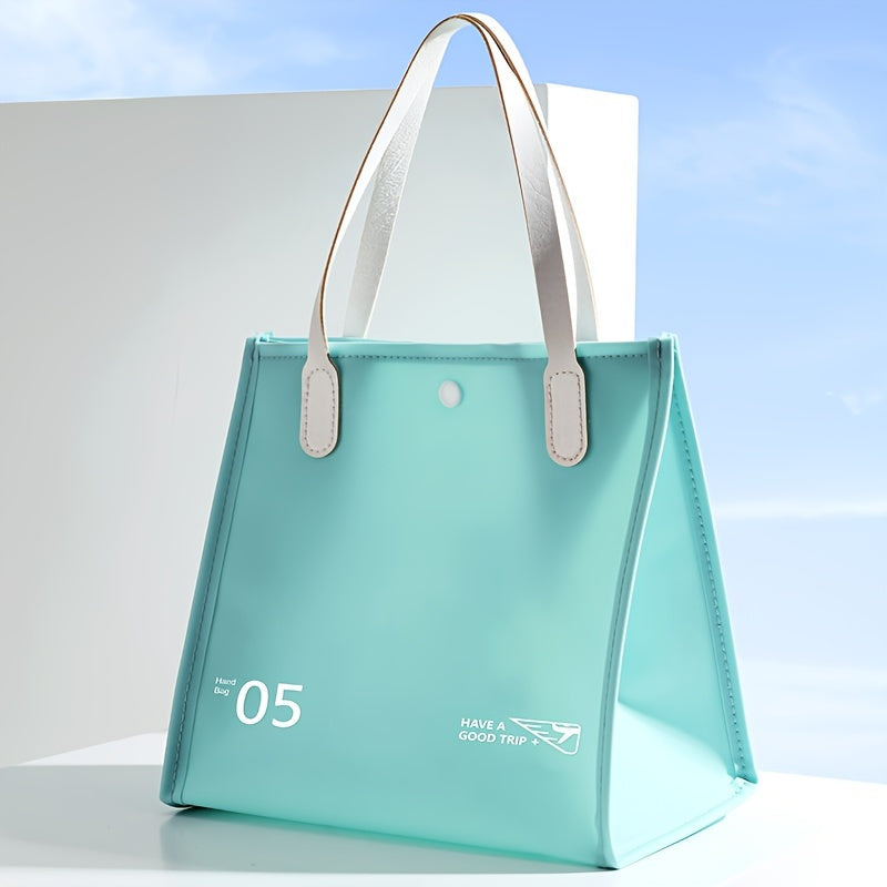 Borsa termica azzurra con manici bianchi, design moderno, scritta "Have a Good Trip", ideale per picnic e viaggi.