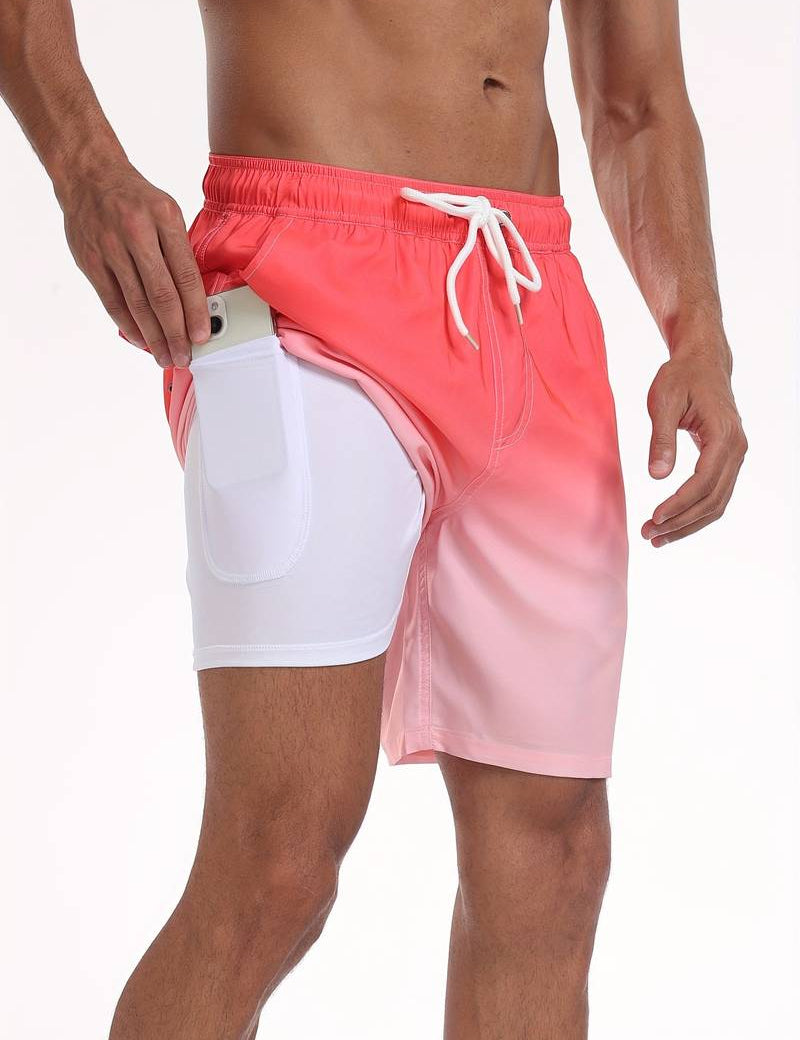 Shorts da uomo rosa sfumati con tasca laterale per smartphone, design moderno, ideale per nuoto e sport estivi. Tessuto leggero e traspirante.