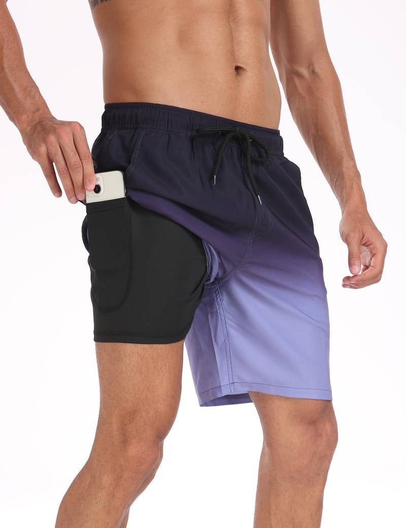 Shorts da uomo sfumati blu e neri con tasca per cellulare, design sportivo, elastico in vita, ideali per palestra e attività all'aperto.