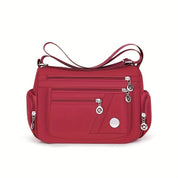 Borsa a tracolla rossa in nylon con zip multiple, design elegante e pratico, ideale per donna. Accessorio moda versatile e resistente.
