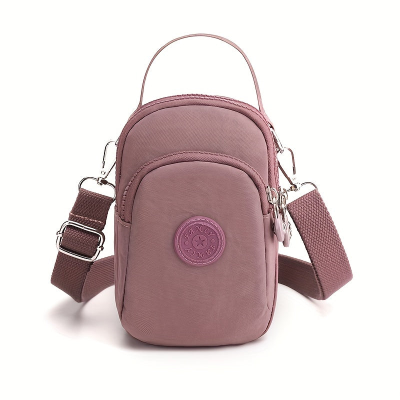 Borsa a tracolla rosa in nylon impermeabile, design compatto con tasche multiple, cerniere robuste, ideale per viaggi e uso quotidiano.