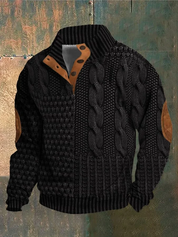 Maglione uomo nero lavorato a maglia con dettagli in pelle marrone, design a trecce e bottoni, ideale per moda autunno-inverno.