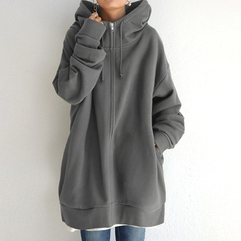 Felpa oversize con cappuccio grigio, zip frontale, maniche lunghe, stile casual. Ideale per moda autunnale e invernale.