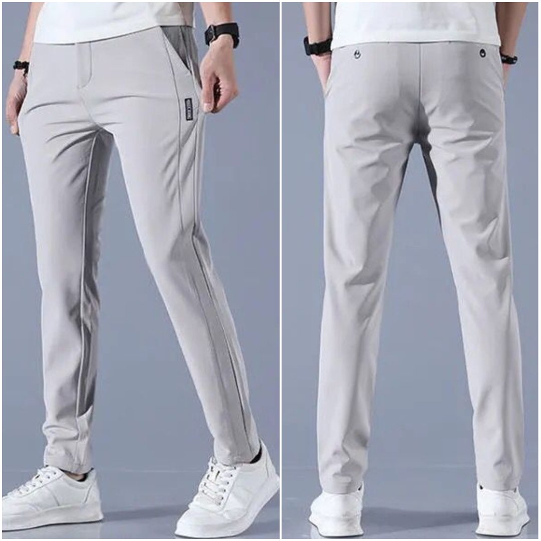 Pantaloni sportivi grigi da uomo, vestibilità slim, tessuto traspirante, ideali per attività sportive e casual, con tasche laterali.