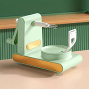 Pelapatate automatico verde, design moderno, con base stabile e lama in acciaio inox, ideale per cucina efficiente e veloce.