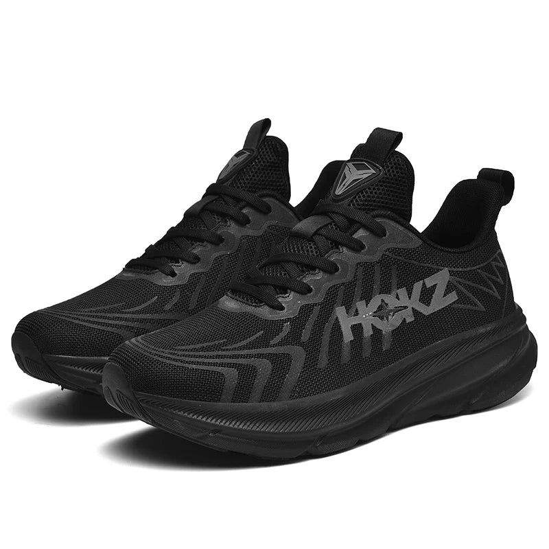 Scarpe da ginnastica nere da uomo, design moderno con suola spessa e dettagli grafici. Sneakers leggere e comode, ideali per sport e tempo libero.