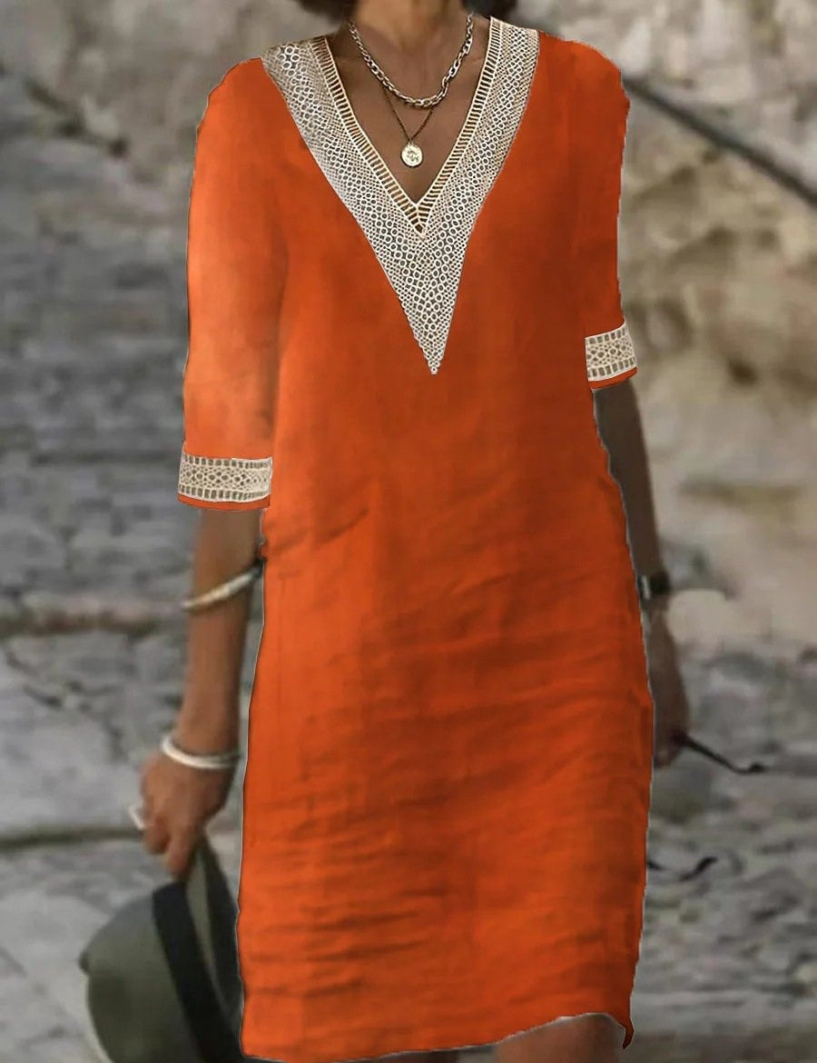 Abito estivo arancione con scollo a V e dettagli in pizzo bianco, maniche a tre quarti, perfetto per moda casual donna.