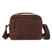 Borsa a tracolla in pelle marrone, design elegante con cerniera frontale, ideale per uomo e donna, perfetta per lavoro e viaggio.