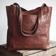 Borsa tote in pelle marrone, design elegante e spazioso, ideale per moda donna. Perfetta per shopping e uso quotidiano. Accessorio di tendenza.