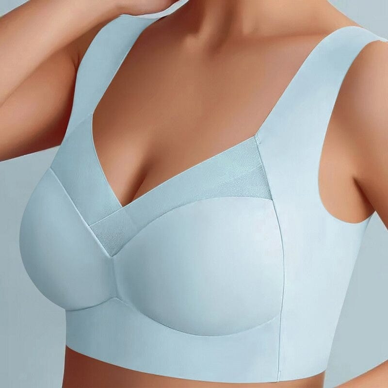 Reggiseno sportivo senza cuciture azzurro, design confortevole con spalline larghe e supporto ottimale, ideale per attività fisica e uso quotidiano.