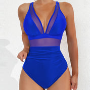 Costume intero blu donna, design con inserti in rete trasparente, scollo a V profondo, moda mare estate, elegante e moderno.