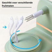 Dispositivo sbucciatore automatico verde per frutta, adatto a diverse dimensioni. Utensile da cucina innovativo con lame rotanti.