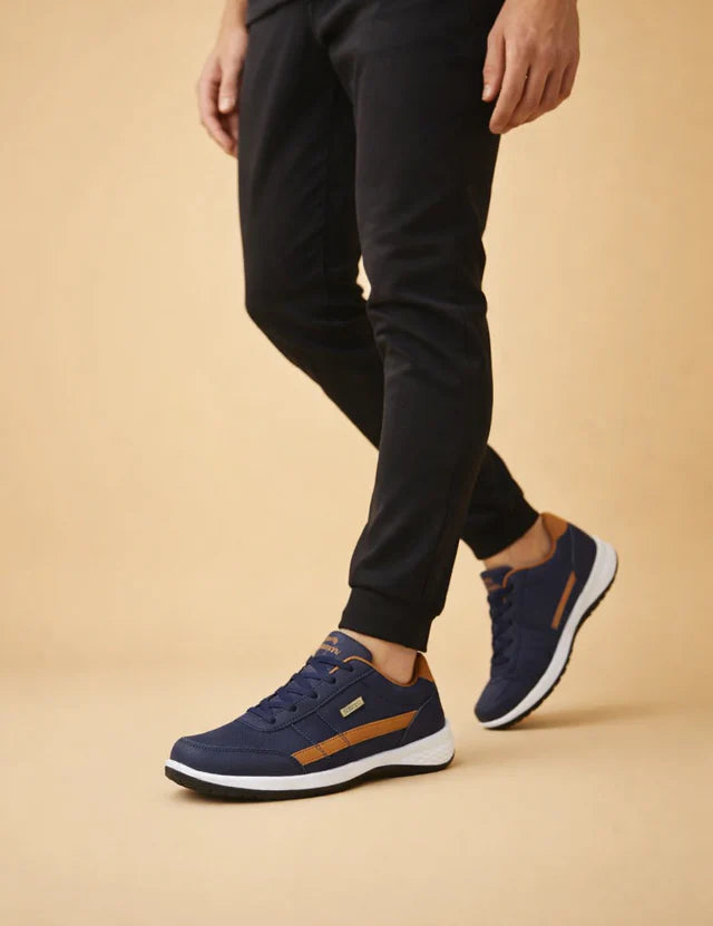 polish-male-model-wearing-navy-tan-sneakers-european-studio-posed-shot.webp