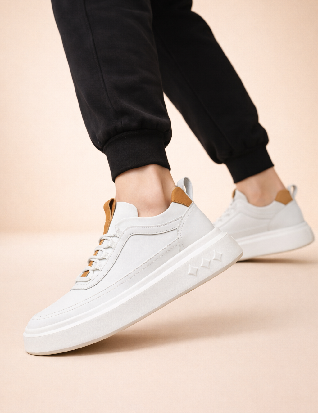 polish-male-model-wearing-white-and-caramel-leather-platform-sneakers-european-studio-shot_37f78a5f-6ef2-40b5-b48c-19ef5a4fdd32.png
