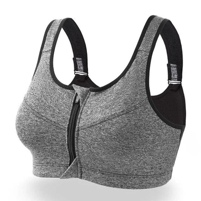 Reggiseno sportivo grigio con zip frontale, spalline larghe regolabili, tessuto traspirante. Ideale per attività fisica e comfort quotidiano.
